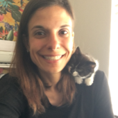 Image of Regina with a kitten on her shoulder